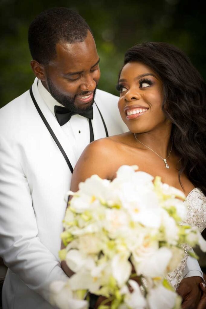 newly-married-couple-taking-picture-in-park